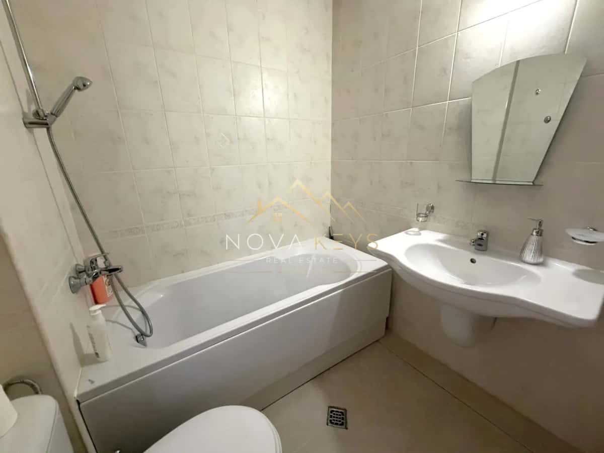 Bathroom with bathtub and sink, studio for rent in Razlog.