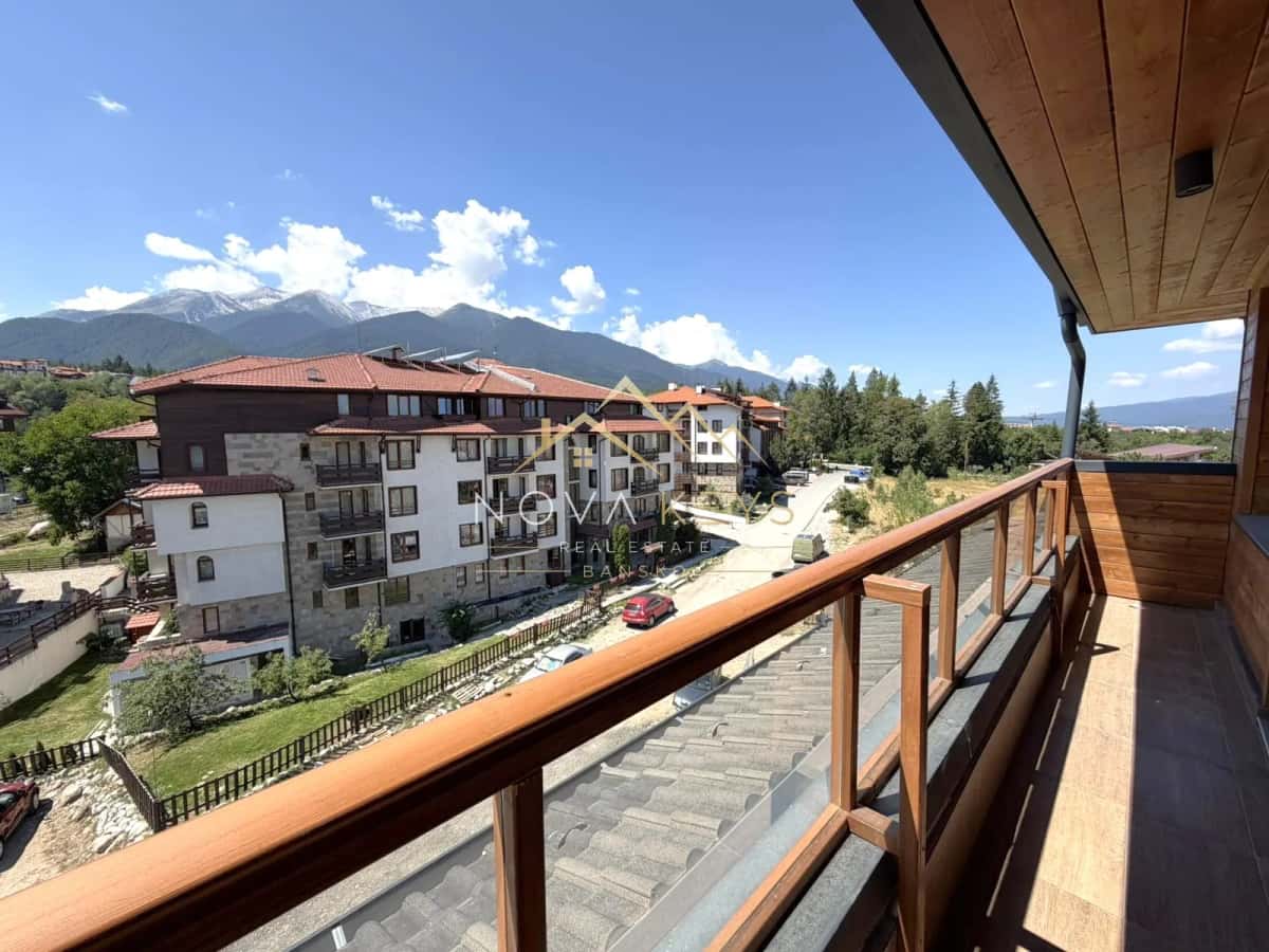 Balcony with mountain view, two-bedroom apartment for sale in the Bansko ski area.