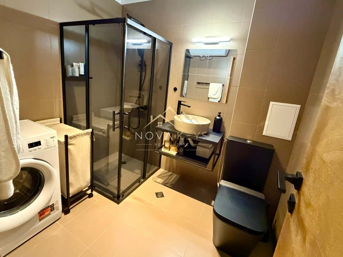 compact bathroom with glass shower and vessel sink, two-bedroom apartment for sale in Pirin Golf.
