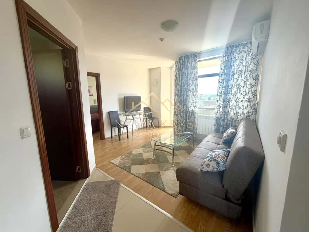 living room with gray sofa and glass coffee table, two-bedroom apartment for sale in Razlog.