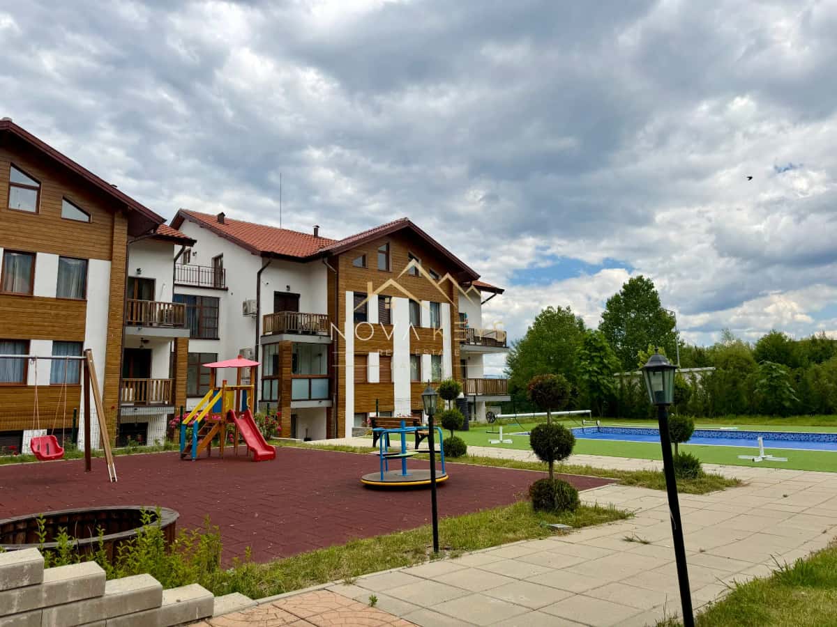 Apartment courtyard with playground and pool, two-bedroom apartment for sale in Pirin Golf.