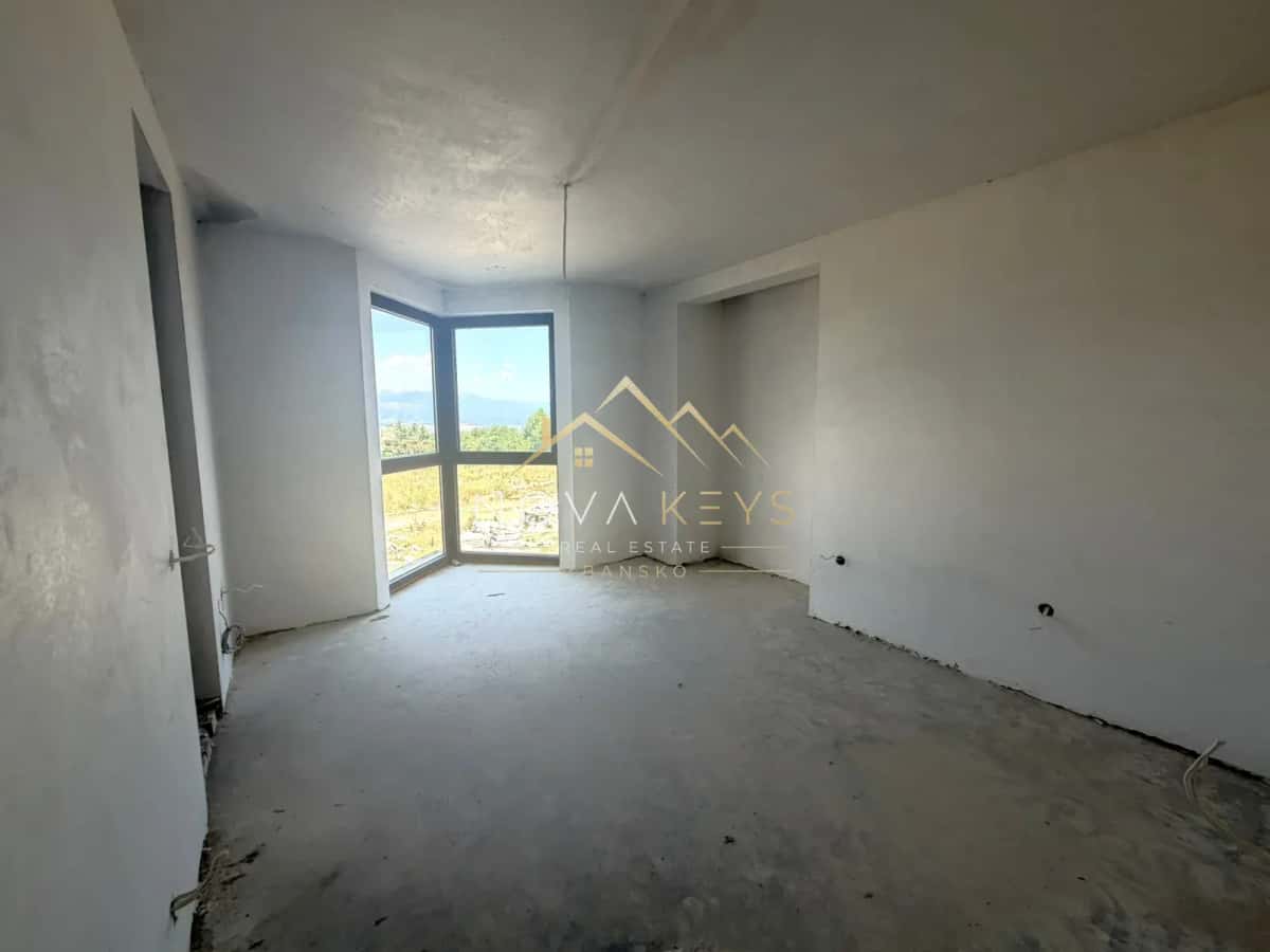 unfinished room with corner window, three-bedroom apartment for sale in the Bansko ski area.