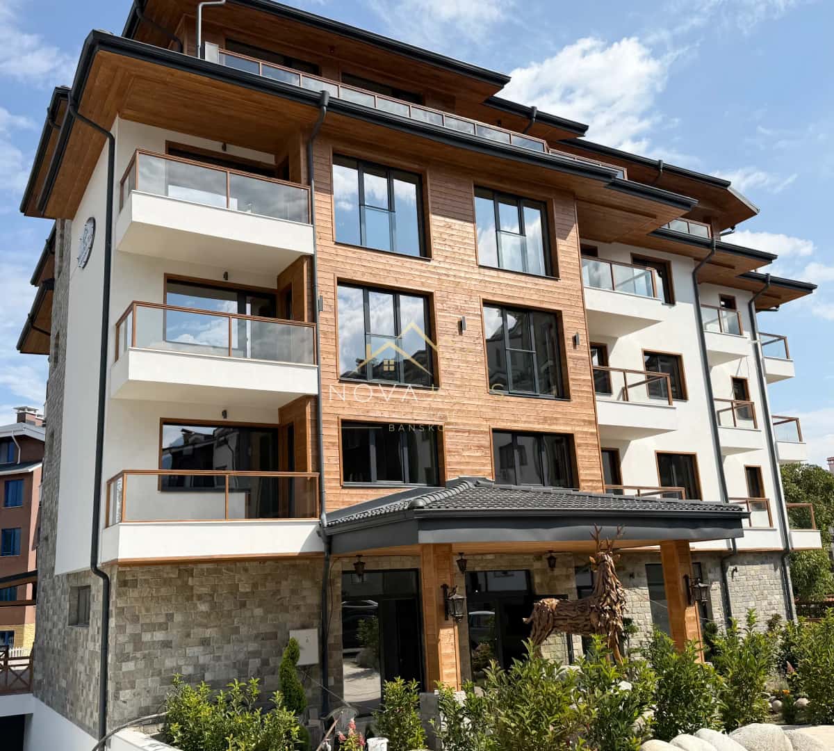 Modern apartment building with balconies, three-bedroom apartment for sale in the Bansko ski area.