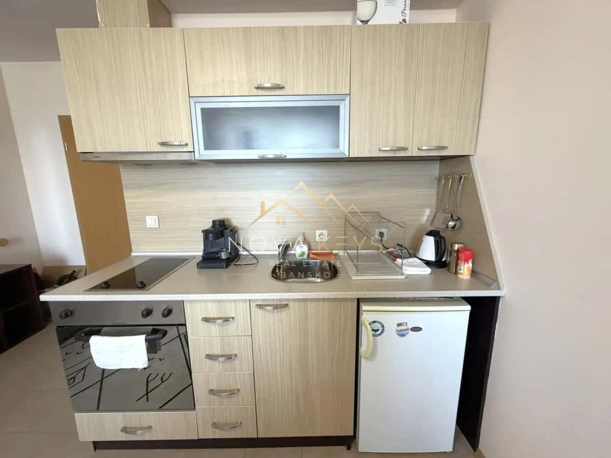 compact kitchen with cabinets and appliances, studio for rent in Razlog.