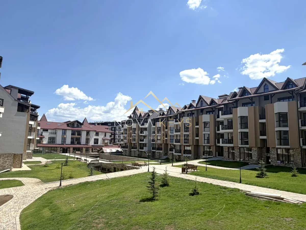 courtyard with apartment buildings and walkways, two-bedroom apartment for sale in the Bansko ski area.