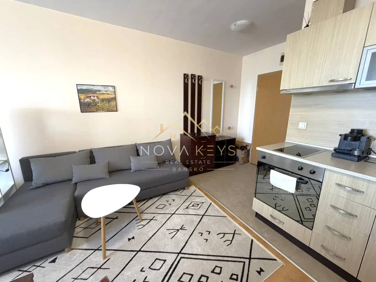 Open-plan living room with sectional sofa and kitchen, studio for rent in Razlog.
