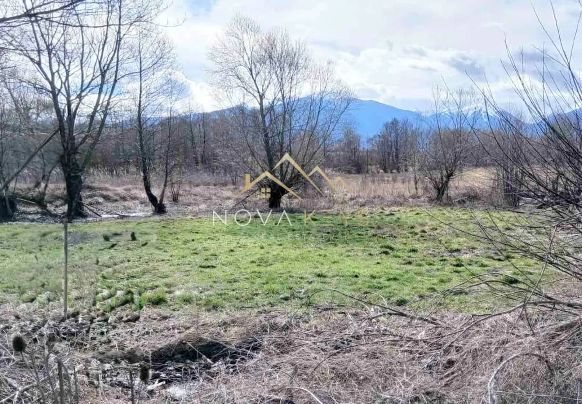 Grassy field with trees and mountains, agricultural land for sale in Banya.