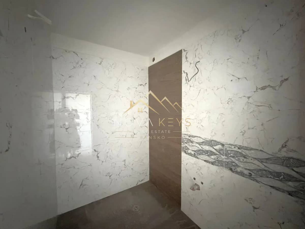 unfinished tiled bathroom, three-bedroom apartment for sale in the Bansko ski area.