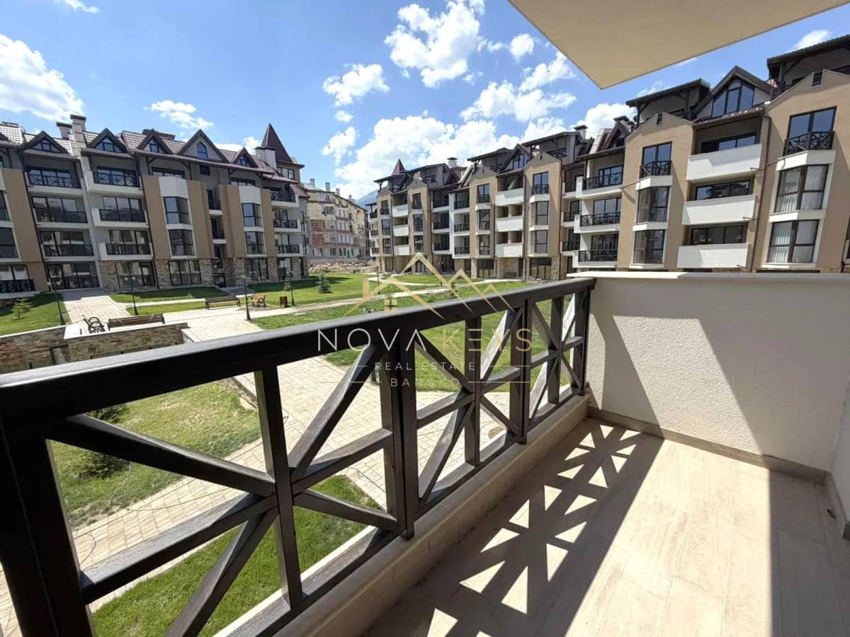 balcony overlooking courtyard, three-bedroom apartment for sale in the Bansko ski area.