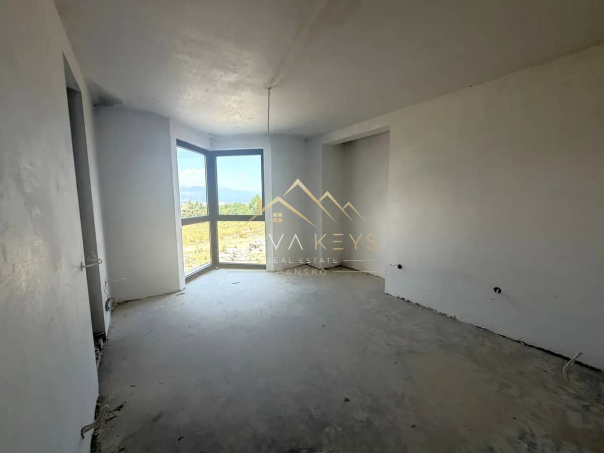 unfinished room with corner window, three-bedroom apartment for sale in the Bansko ski area.