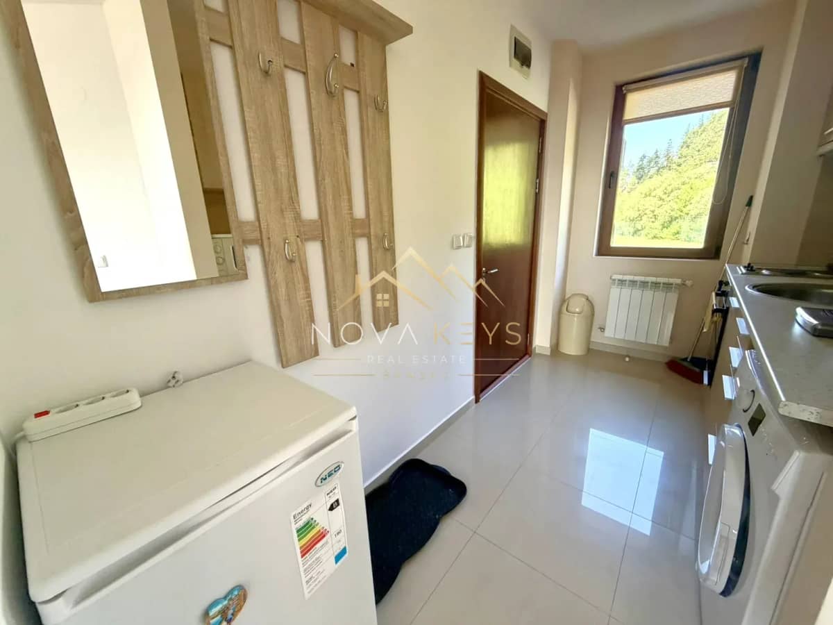 galley kitchen with window and appliances, two-bedroom apartment for sale in Razlog.