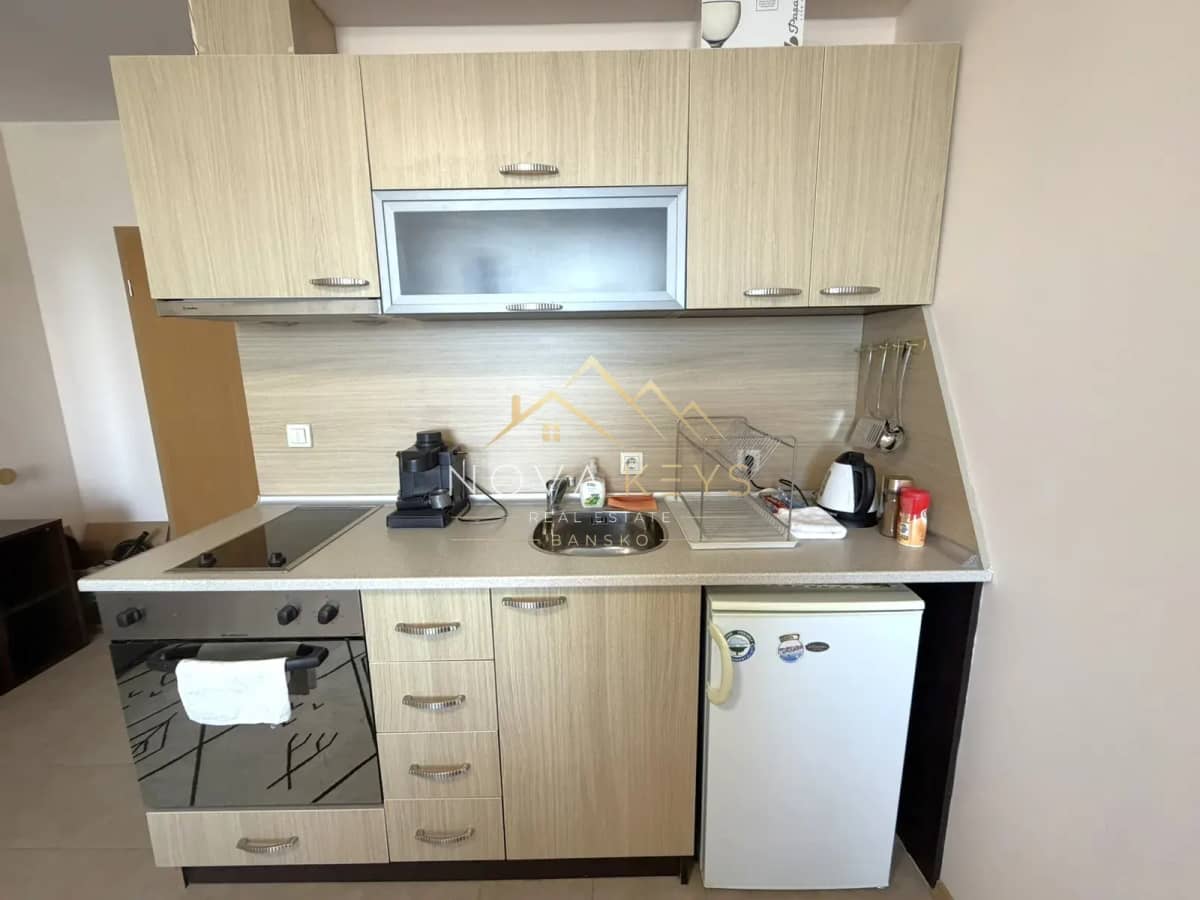 compact kitchen with cabinets and appliances, studio for rent in Razlog.