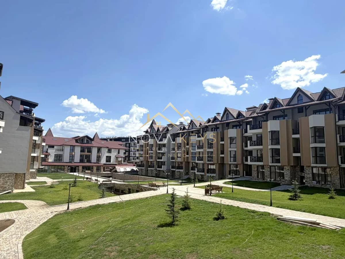 courtyard with apartment buildings and walkways, two-bedroom apartment for sale in the Bansko ski area.