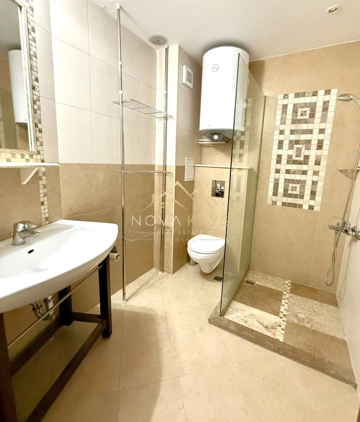 Bathroom with sink, shower, and toilet, two-bedroom apartment for sale in the Bansko ski area.