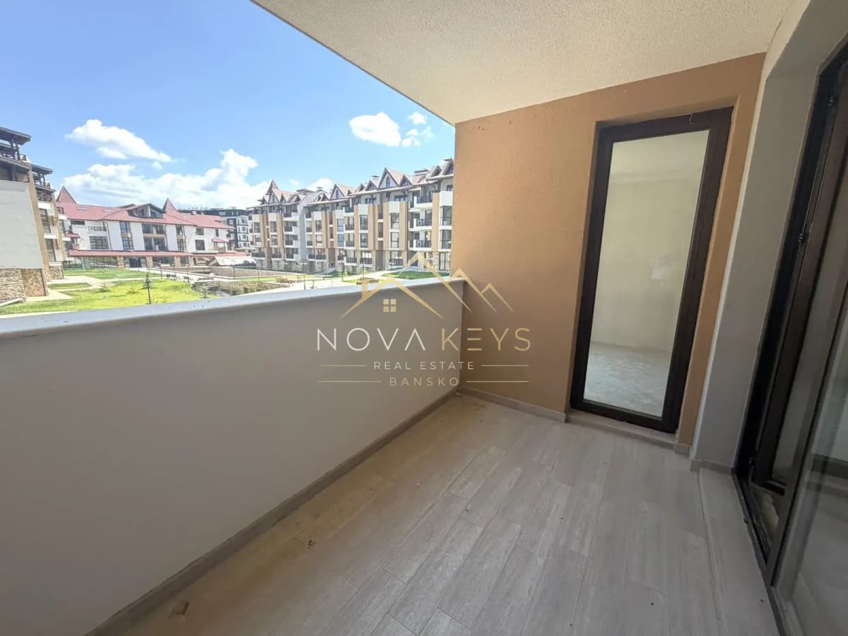 Empty covered balcony with courtyard view, studio for sale in the Bansko ski area.