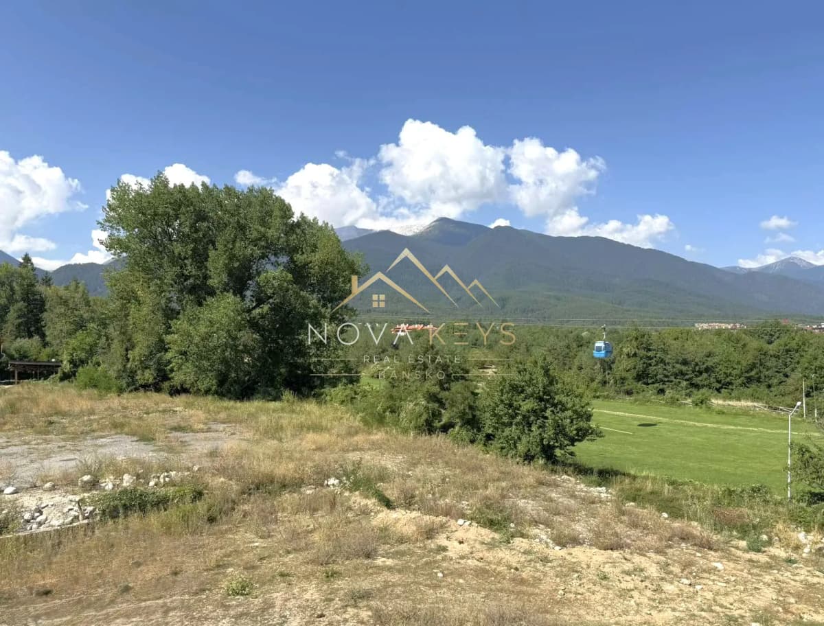 mountain landscape with trees and field, two-bedroom apartment for sale in the Bansko ski area.
