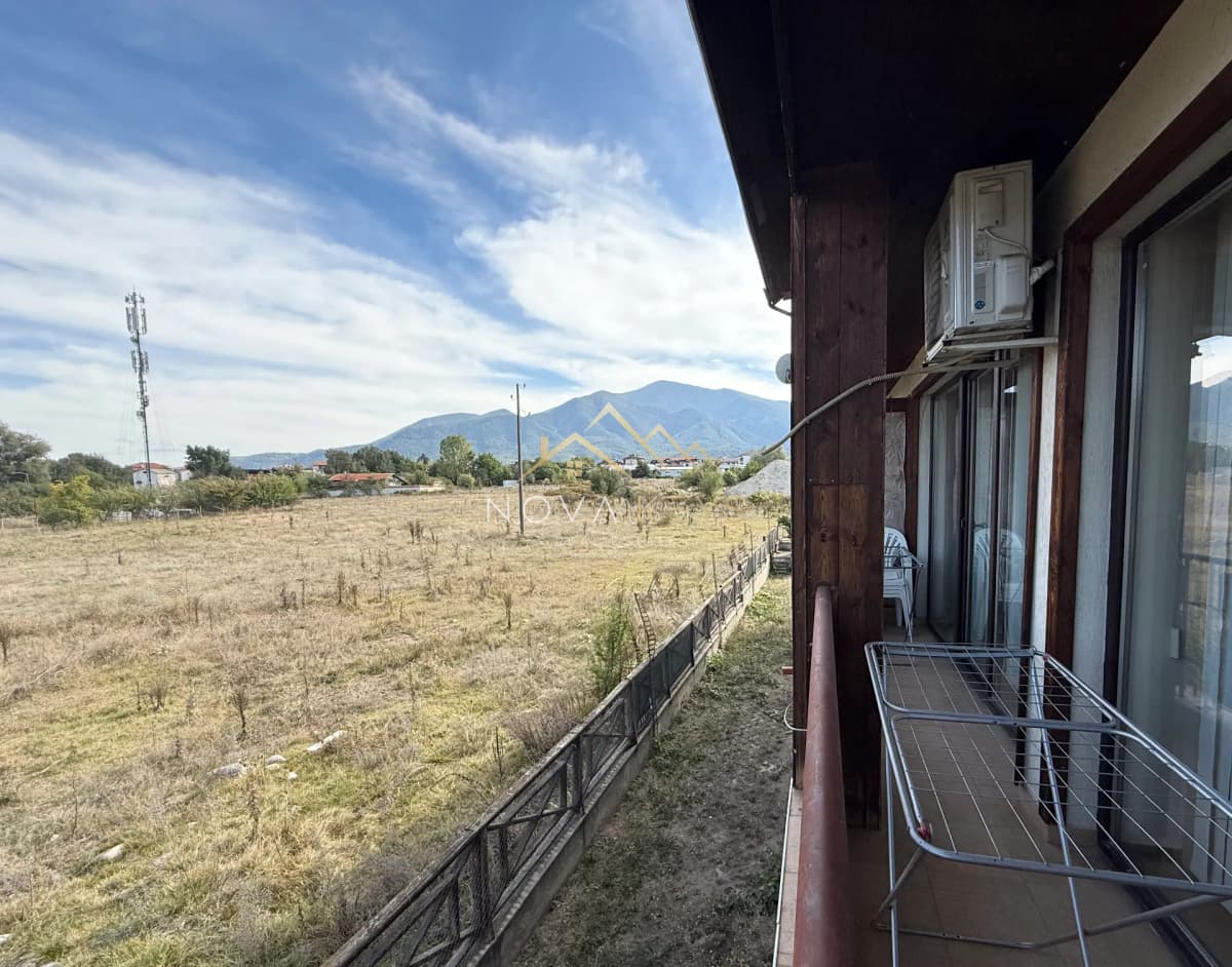Balcony with drying rack and mountain view, three-bedroom apartment for sale in Bansko.