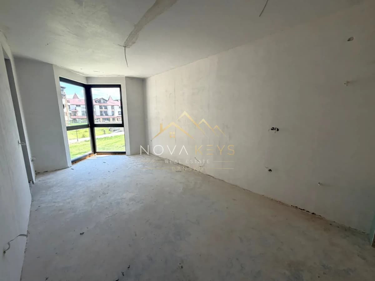 unfinished room with corner window, two-bedroom apartment for sale in the Bansko ski area.