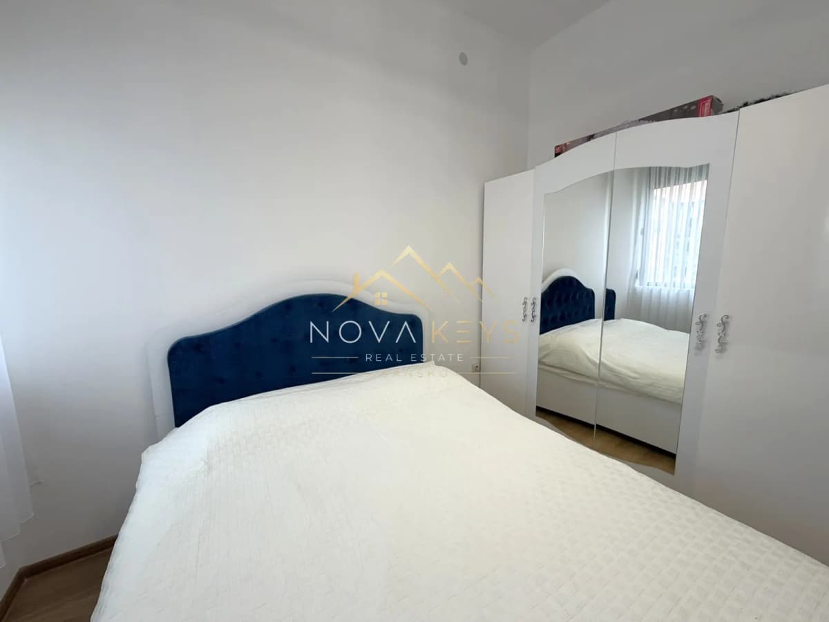Small bedroom with bed and mirrored wardrobe, two-bedroom apartment for sale in Pirin Golf.