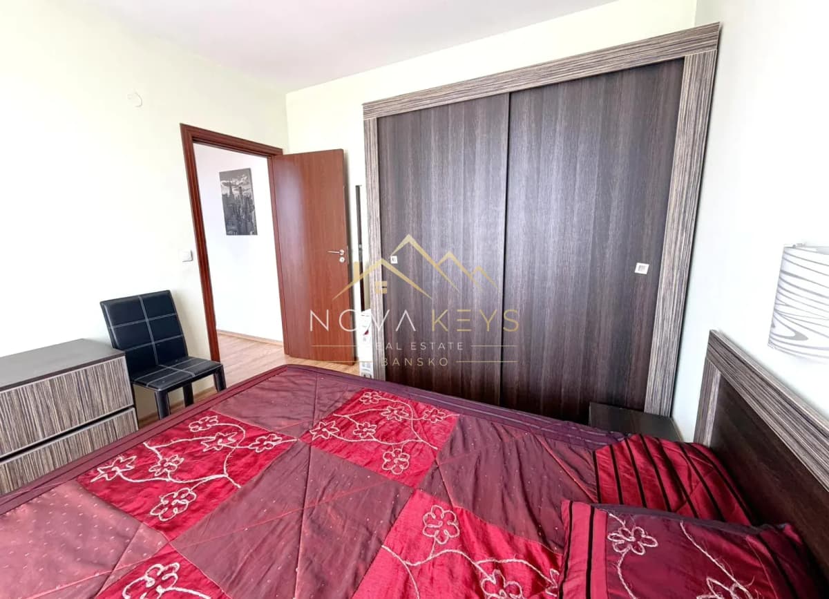 Bedroom with bed and sliding wardrobe, two-bedroom apartment for sale in Razlog.