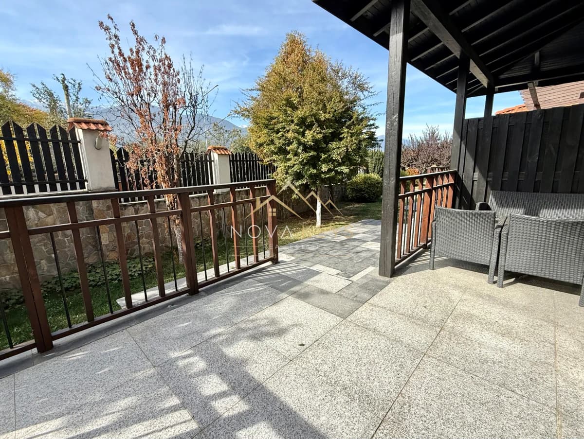 Covered patio with tiled floor and outdoor seating, house for sale in Dobrinishte.