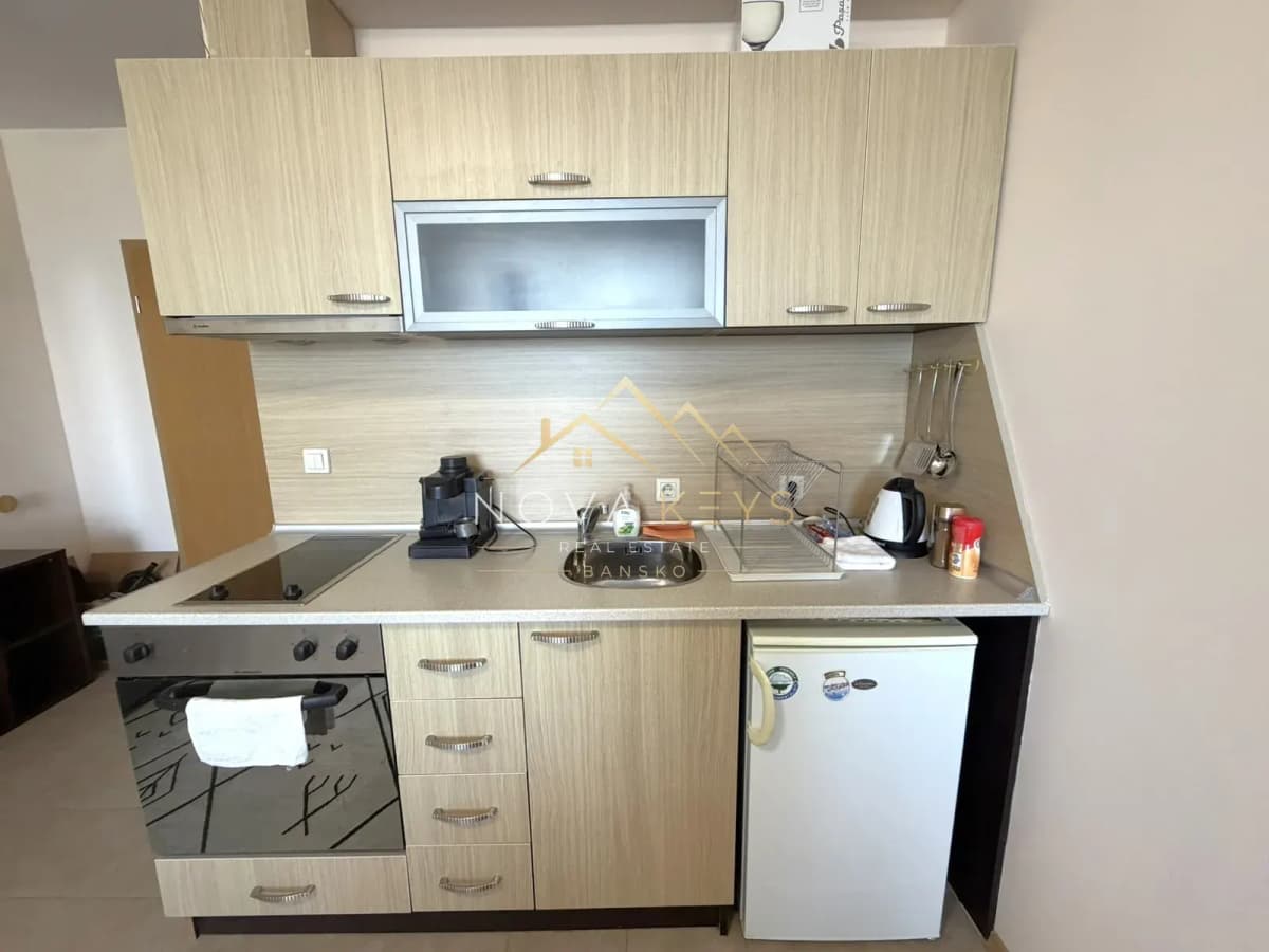 compact kitchen with cabinets and appliances, studio for rent in Razlog.