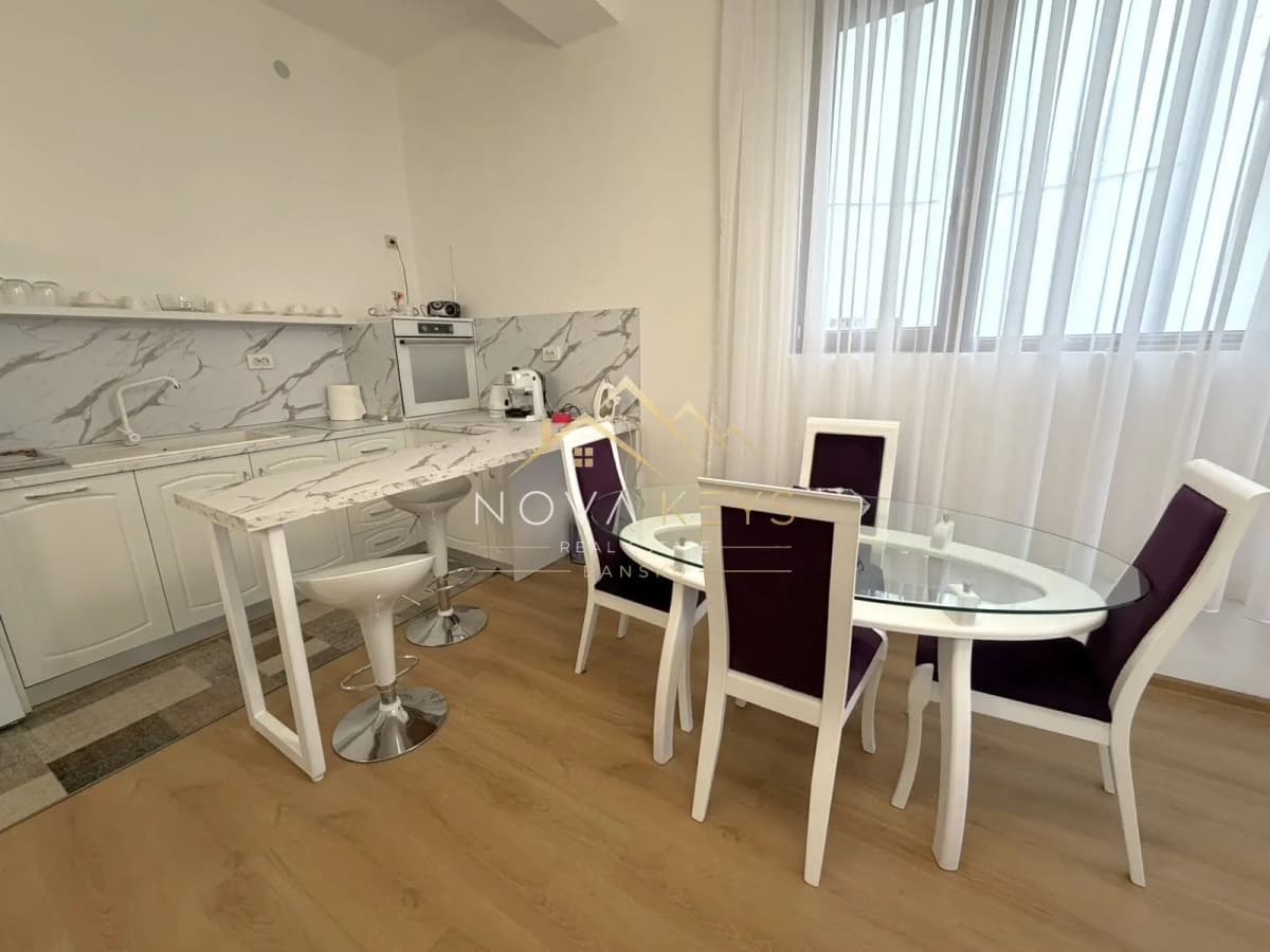 modern kitchen and dining area with glass table, two-bedroom apartment for sale in Pirin Golf.