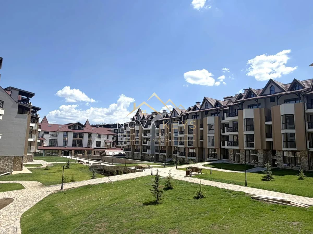 courtyard with apartment buildings and walkways, two-bedroom apartment for sale in the Bansko ski area.